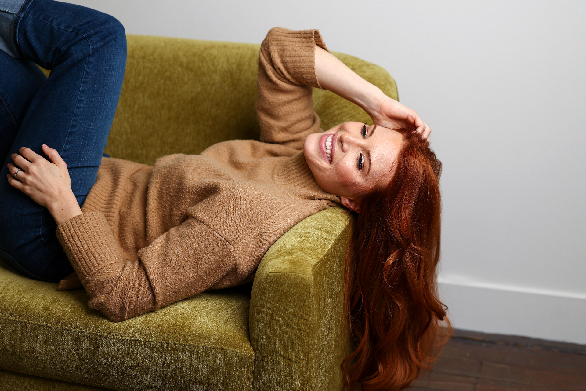 LOXXIE hand-tied weft hair extensions in Spiced Auburn on redhead model